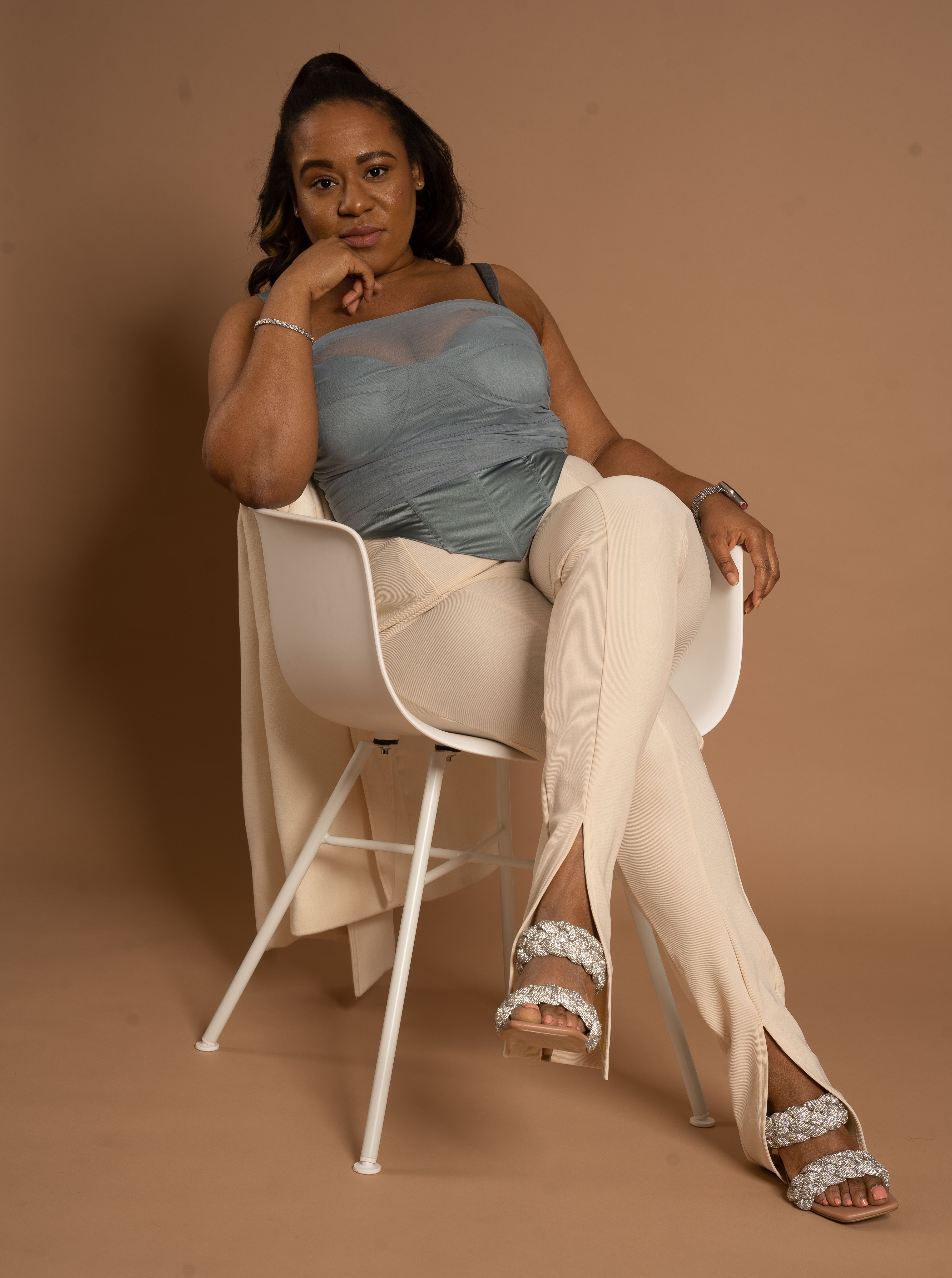 Anita, UGC creator, seated portrait